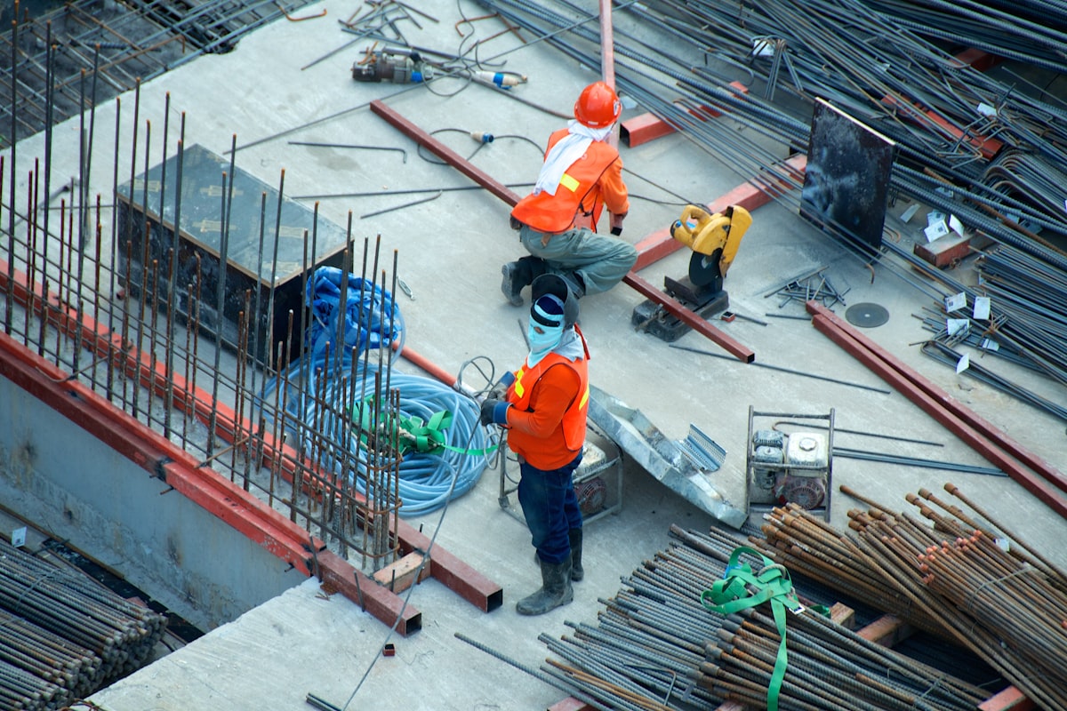 Site manager with a tablet reviewing progress on a construction project
