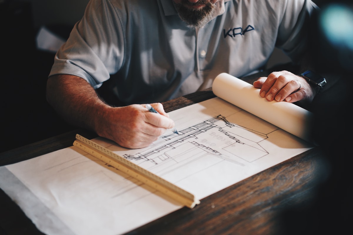 Engineers reviewing technical drawings on a construction site