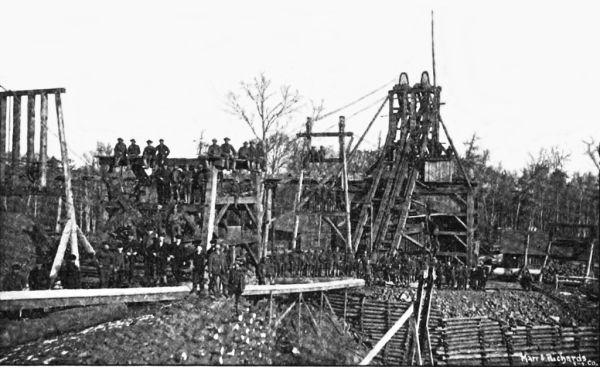 Open-cast mine with heavy machinery and excavation equipment